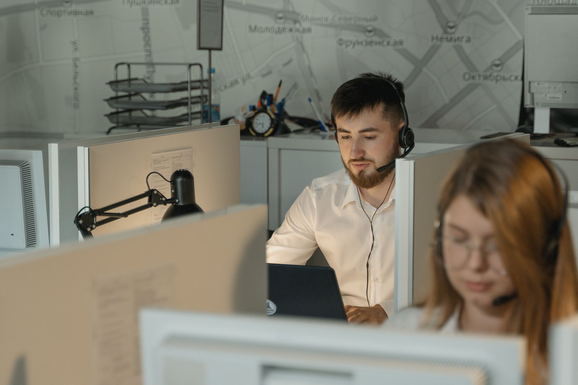 Help desk agent wearing a headset while assisting a user