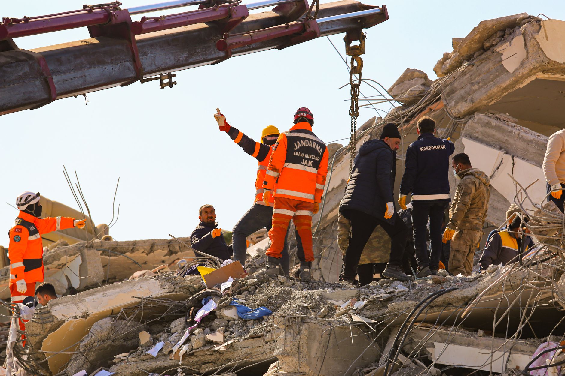 Rescue workers searching earthquake rubble for survivors, the kind of search-and-rescue effort mounted in Haiti in 2010