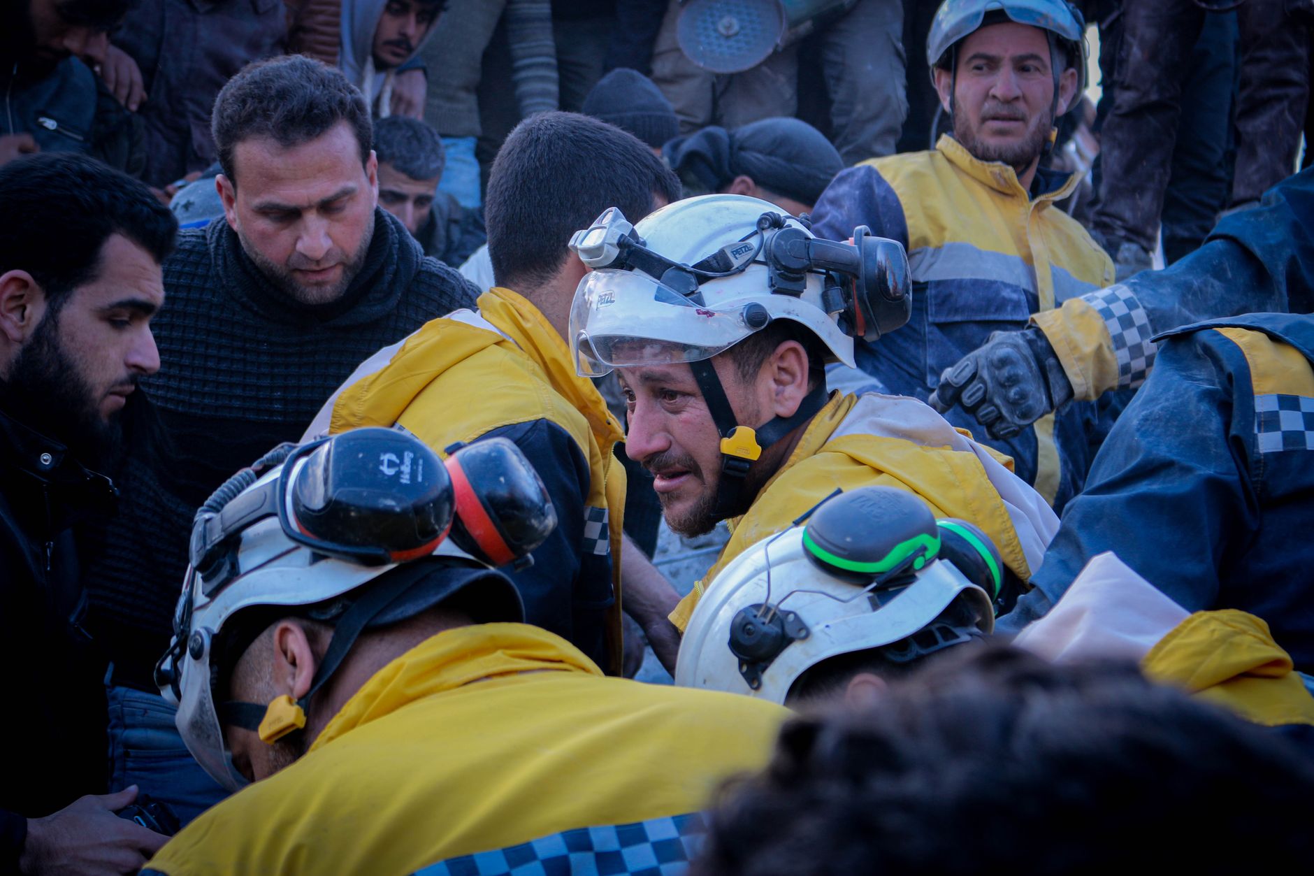 Humanitarian relief workers helping after a natural disaster, similar to the response after Haiti 2021