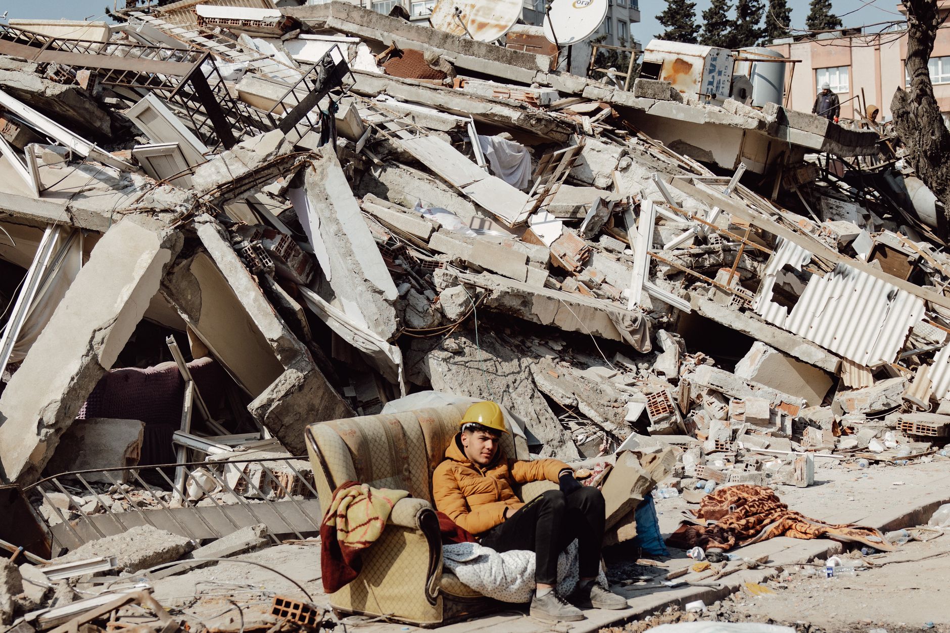 Person protecting themselves during earthquake